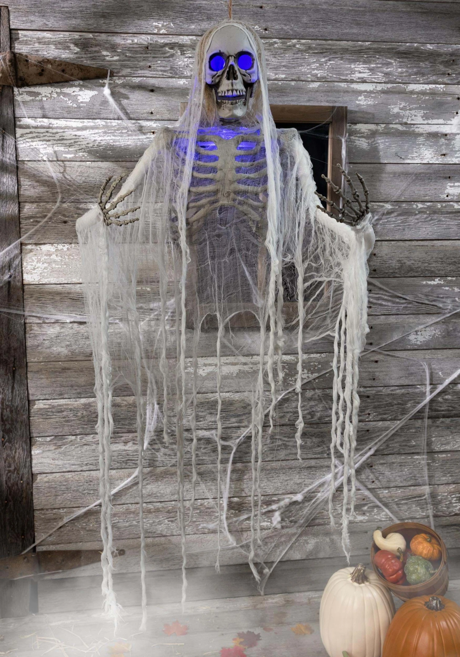 Haunted Hanging Skeleton With Blue Light Up Eyes Decoration 1 Haunted Hanging Skeleton With Blue Light Up Eyes Decoration